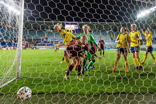 Caroline Seger sees Magdalena Eriksson of Sweden score 4-0