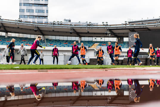 Players reflected in water