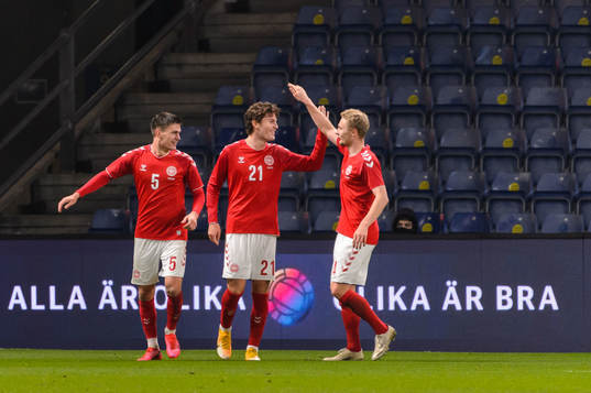 Jonas Wind of Denmark celebrate with teammates
