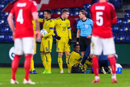 Alexander Isak of Sweden receives medical attention
