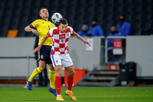Pierre Bengtsson of Sweden and Ivan Perisic of Croatia
