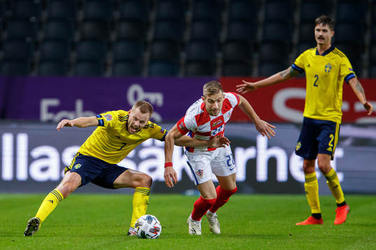 Sebastian Larsson and Mikael Lustig of Sweden against Dario