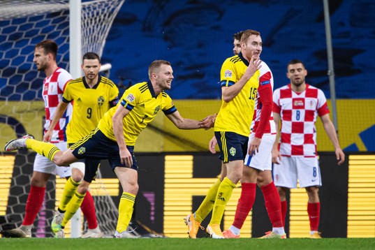Sebastian Larsson and Dejan Kulusevski of Sweden celebrate