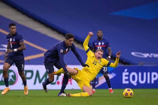 Raphael Varane of France and Dejan Kulusevski of Sweden