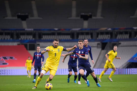 Marcus Berg of Sweden and Lucas Digne of France