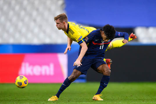 Emil Krafth of Sweden and Kingsley Coman of France