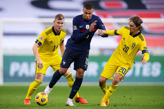 Emil Krafth and Kristoffer Olsson of Sweden are being