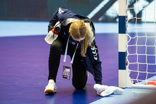 A steward steams the pitch to disinfect it