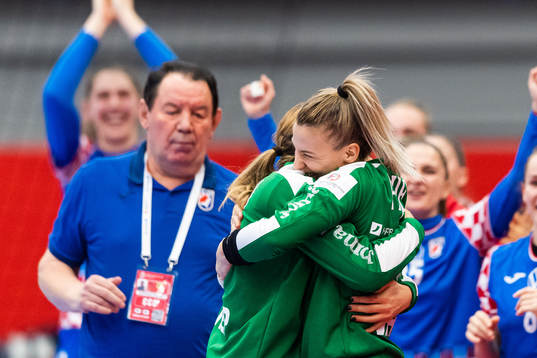 Goalkeepr Tea Pijevic and goalkeeper Lucija Besen embrace