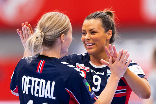 Stine Bredal Oftedal and Nora Mørk of Norway celebrate