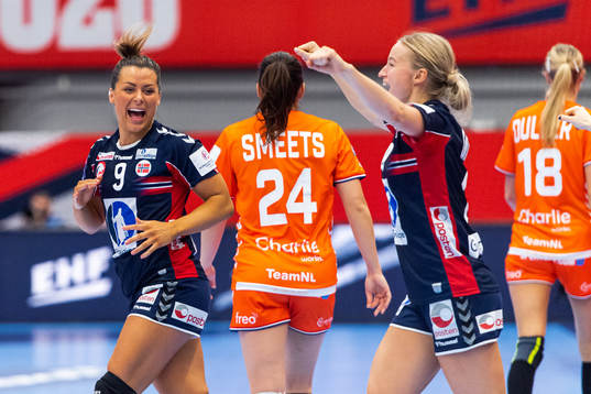 Nora Mørk and Stine Bredal Oftedal of Norway celebrate