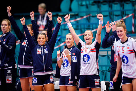 Nora Mørk , Malin Aune and Heidi Løke of Norway celebrate