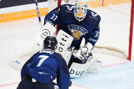 goalkeeper Janne Juvonen of Finland