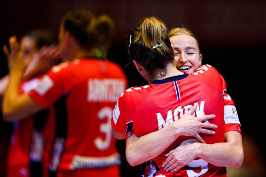 Nora Mørk and Stine Bredal Oftedal of Norway celebrate
