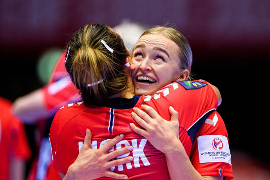 Nora Mørk and Stine Bredal Oftedal of Norway celebrate