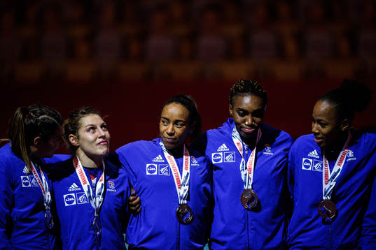 Players of France celebrate with their silver medals