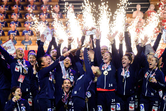 Players of Norway celebrate with the winner’s trophy