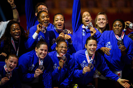 Players of France celebrate with their silver medals