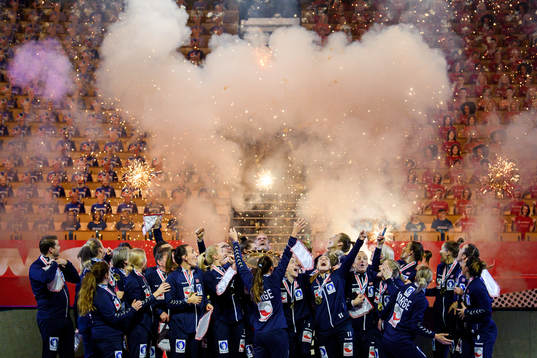 Players of Norway celebrate with the winner’s trophy