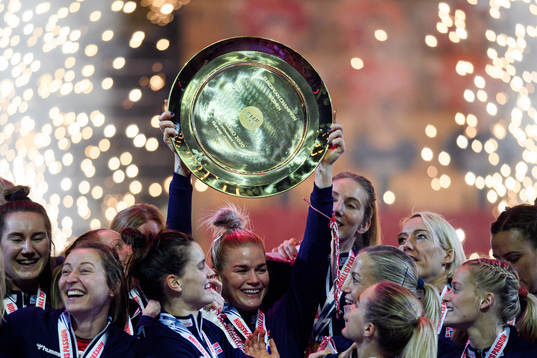 Players of Norway celebrate with the winner’s trophy