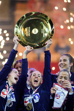 Players of Norway celebrate with the winner’s trophy