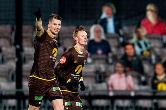 Christian Gauseth of Mjøndalen celebrates with teammate