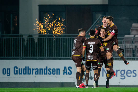 Markus Nakkim of Mjøndalen celebrates with teammates