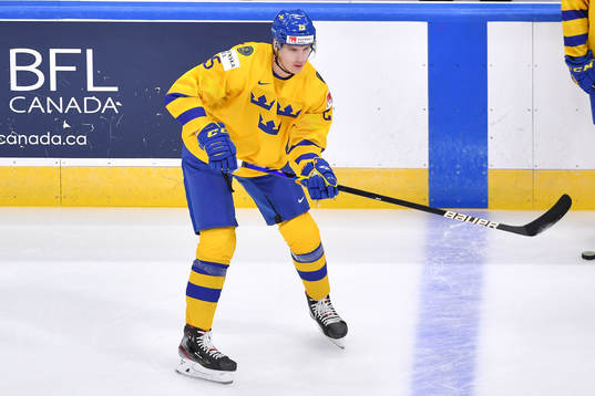Elmer Söderblom of Sweden passes the puck