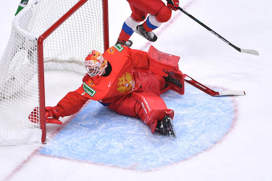 Yaroslav Askarov of Russia reaches back for the puck