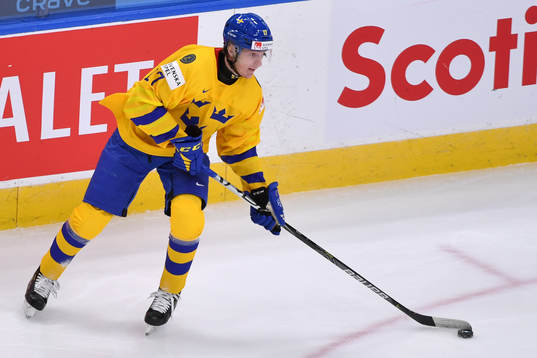 Oskar Kvist of Sweden prepares to make a pass