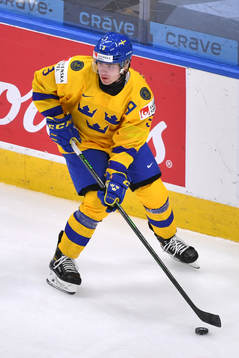 Tobias Björnfot of Sweden skates with the puck