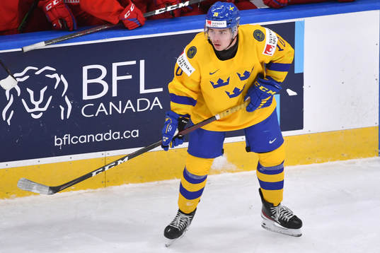 Alexander Holtz of Sweden looks towards the puck