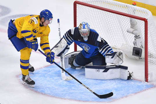 Elmer Söderblom of Sweden makes a backhand attempt