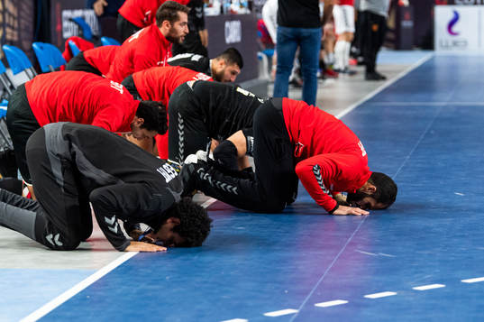 Players of Egypt falls to his knees in prayers