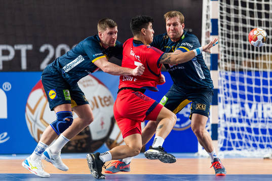 Linus Persson and Max Darj of Sweden defend against Diego