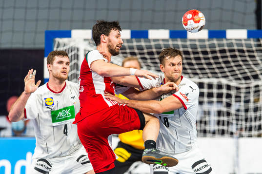 Johannes Golla and Fabian Böhm of Germany defends against