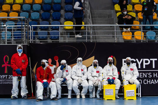 Personel, who work with disinfecting the players bench and
