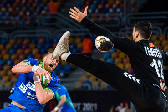 Blaz Blagotinsek of Slovenia and goalkeeper Martin Tomovski