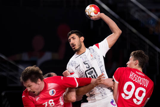 Yahia Omar of Egypt in action with Pavel Andreev and Sergei