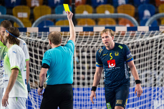 Max Darj of Sweden receives a yellow card