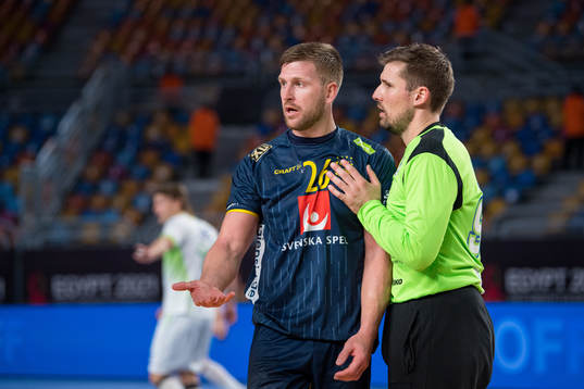 Linus Persson of Sweden and goalkeeper Urban Lesjak of
