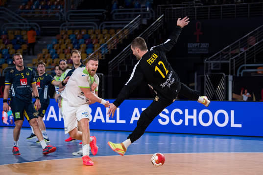 Blaz Blagotinsek of Slovenia and goalkeeper Andreas Palicka