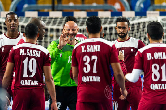 Players of Qatar celebrate