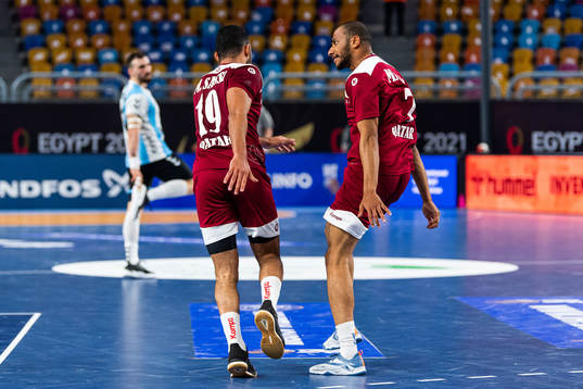 Marwan Sassi and Ahamad Madadi of Qatar celebrate