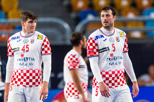 Halil Jaganjac and Domagoj Duvnjak of Croatia look dejected