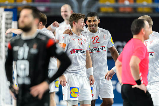 Lasse J. Svan and Mads Larsen Mensah of Denmark celebrate