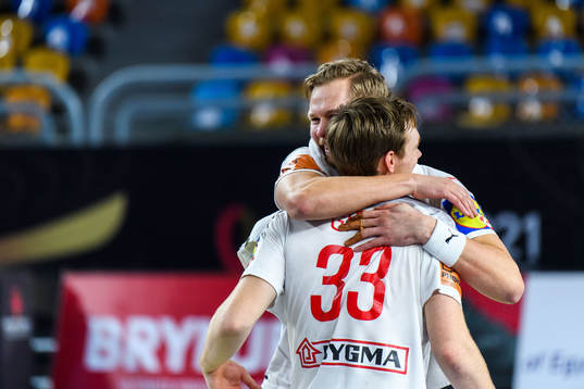 Nikolaj Nielsen and Mathias Gidsel of Denmark celebrate