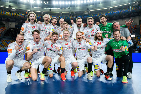 Players of Denmark celebrate with a team group photo
