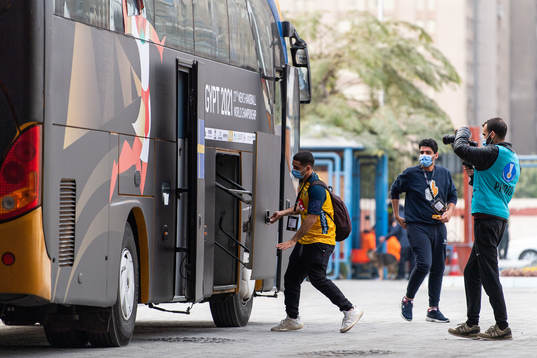 Omar, team guide of Sweden, opens the loading compartment