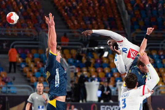 Jonathan Carlsbogård of Sweden defends against Dika Mem of